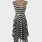 Designer Luxe Deluxe black and white A-line dress in silk with cabana stripes, v-neck, and handkerchief hem for special events or evening wear.