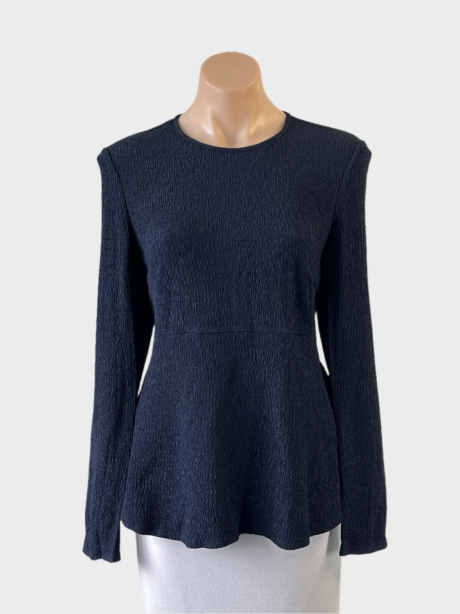Designer Scanlan Theodore navy blue peplum top in puckered weave with round neck for office wear.
