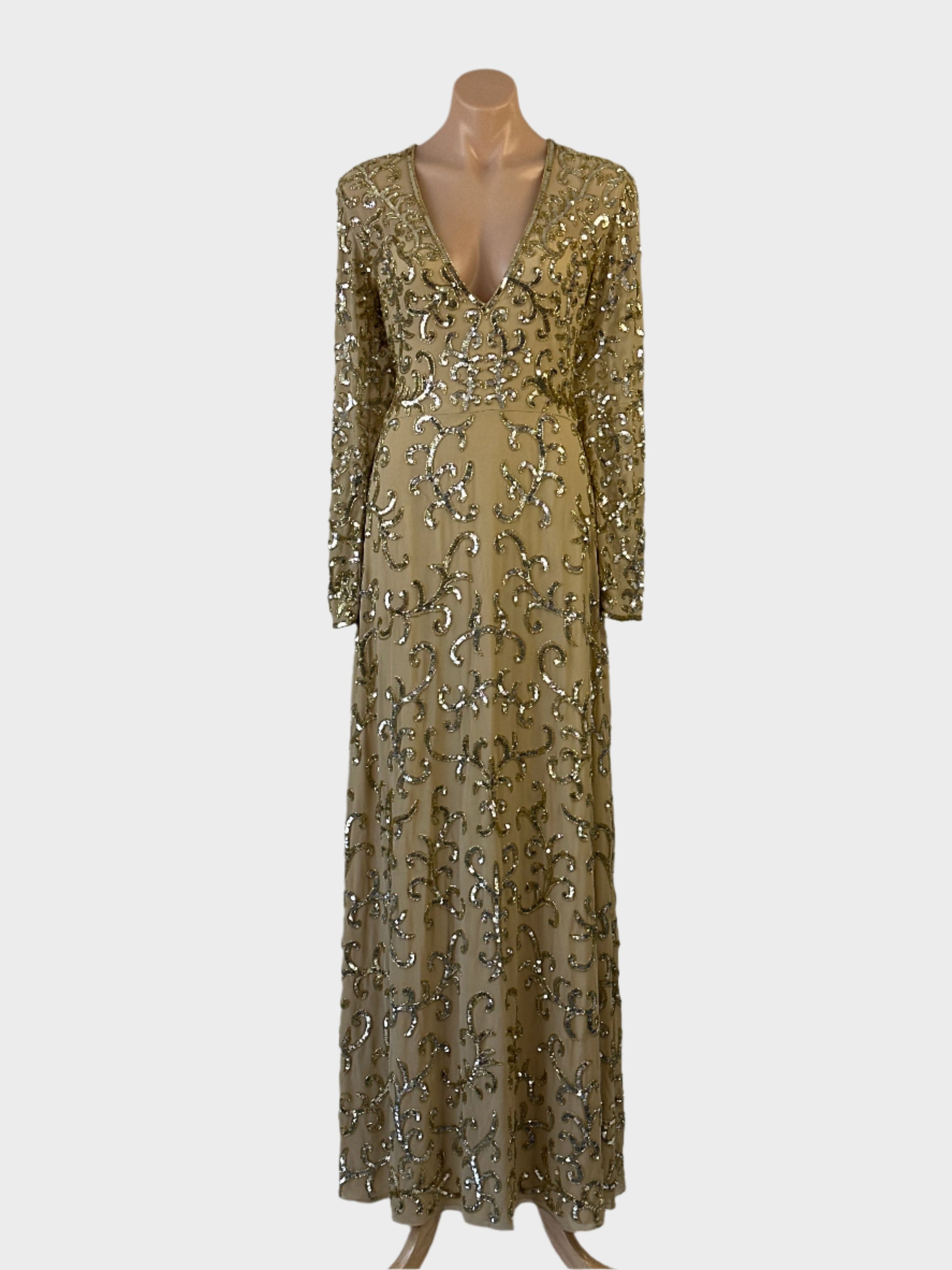 Designer Virgos Lounge gold gown in sheer crepe with sequin-embellished frond motifs, plunge v-neck, and flared skirt for formal wear.