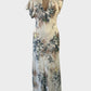 Designer white asymmetric bias cut gown with floral print, notched neck, and slanted hem for special events or evening wear.