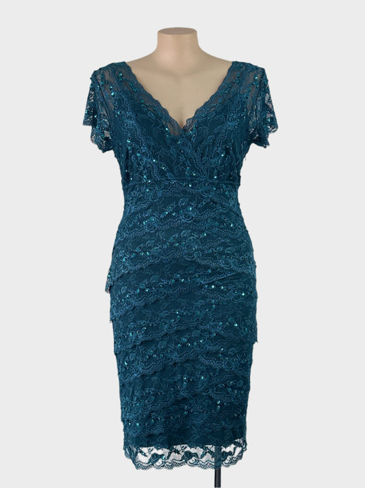 Diana Ferrari teal green sheath dress in lace with sequins, surplice neck, and layered skirt for formal or evening wear.