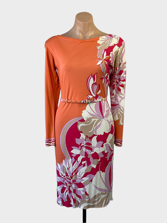 Designer Emilio Pucci knee length dress in orange with a floral print, bateau neck and skinny belt for office or special events.