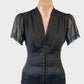Events corset style top in black sheer crepe with boned midriff and puff sleeves for formal or evening wear.