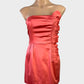 Designer Forever New orange strapless dress with satin finish, ruffle trim, and pleated pencil skirt for formal wear.