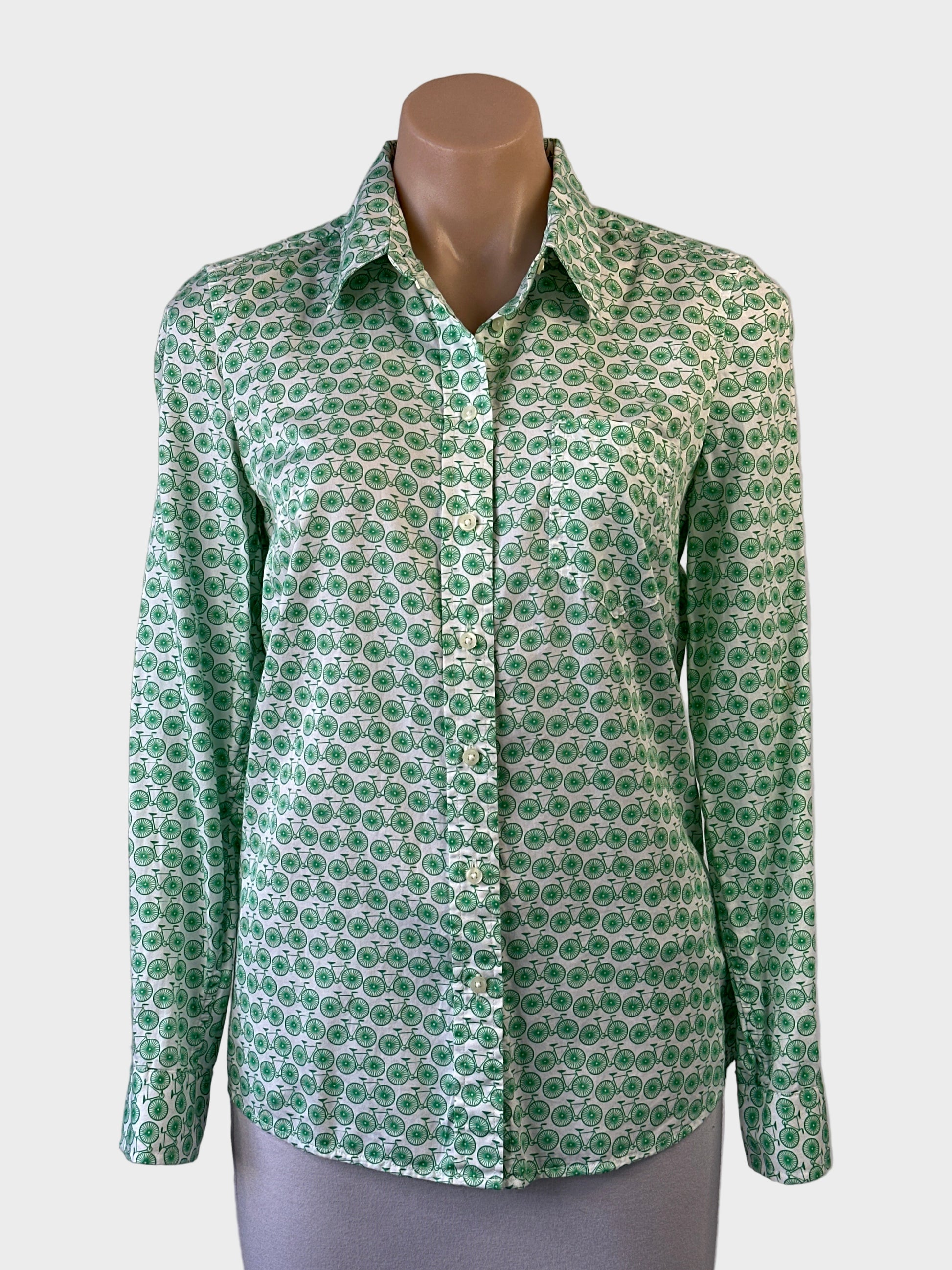 GAP long sleeve shirt in white with green retro bicycle print, button front and curved hem for smart casual wear