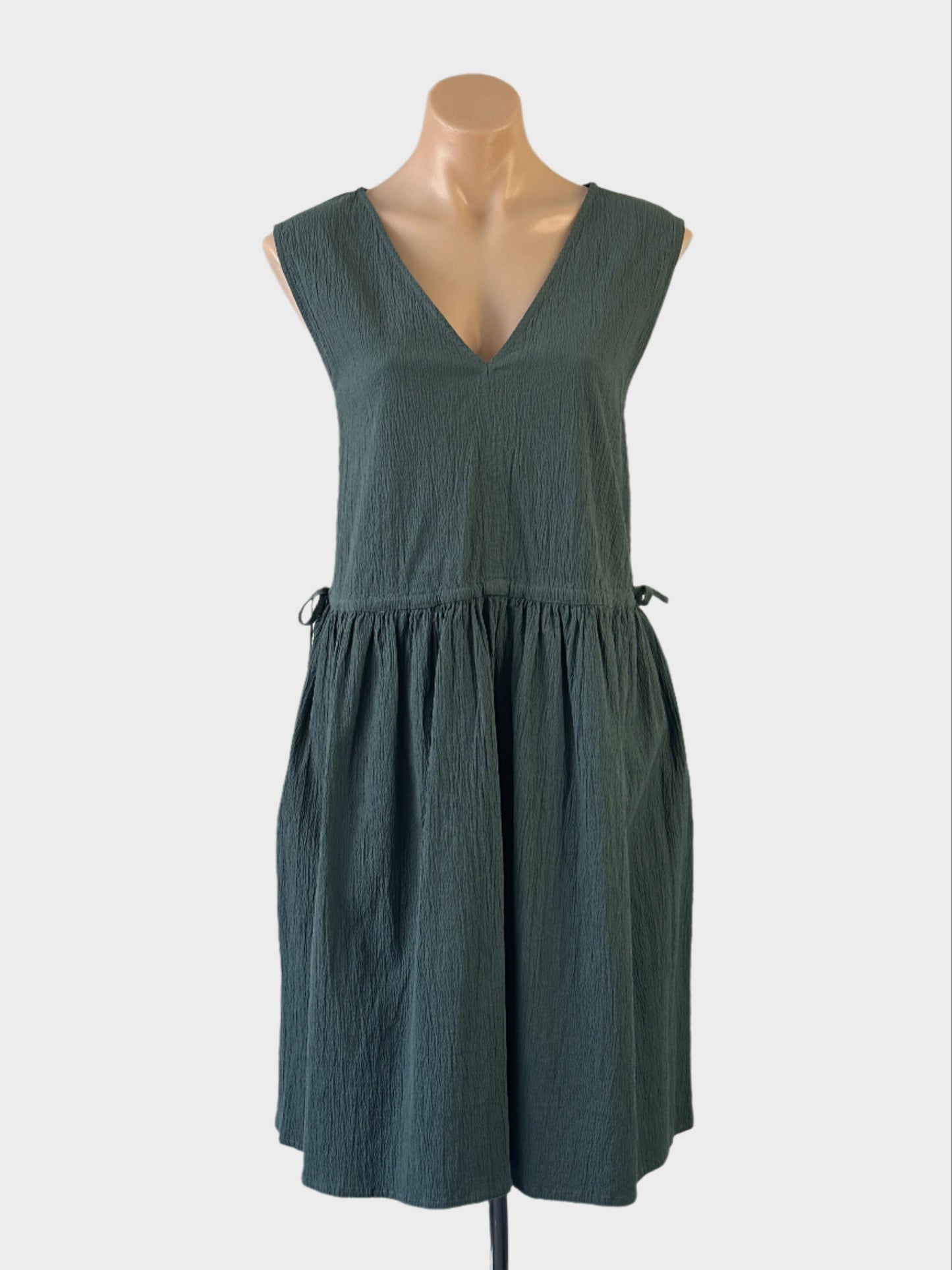 Designer Gorman smock dress in green pure cotton with crinkle weave, v-neck and drawstring drop waist for smart casual wear.