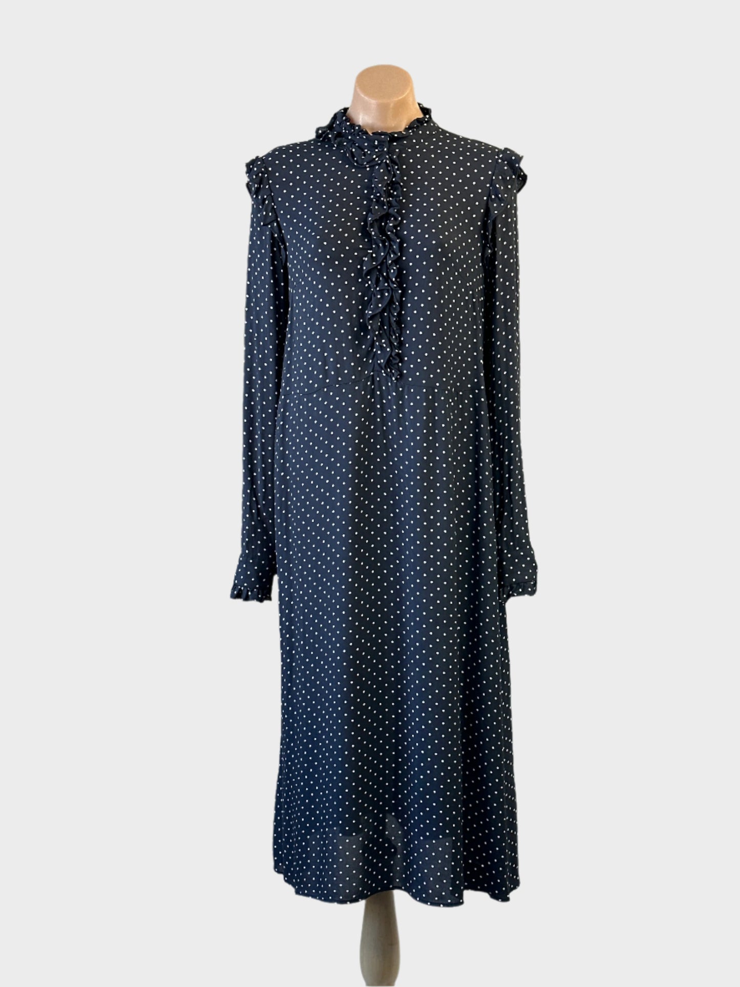 H&M dress in navy with white polka dots and frill details for office wear.