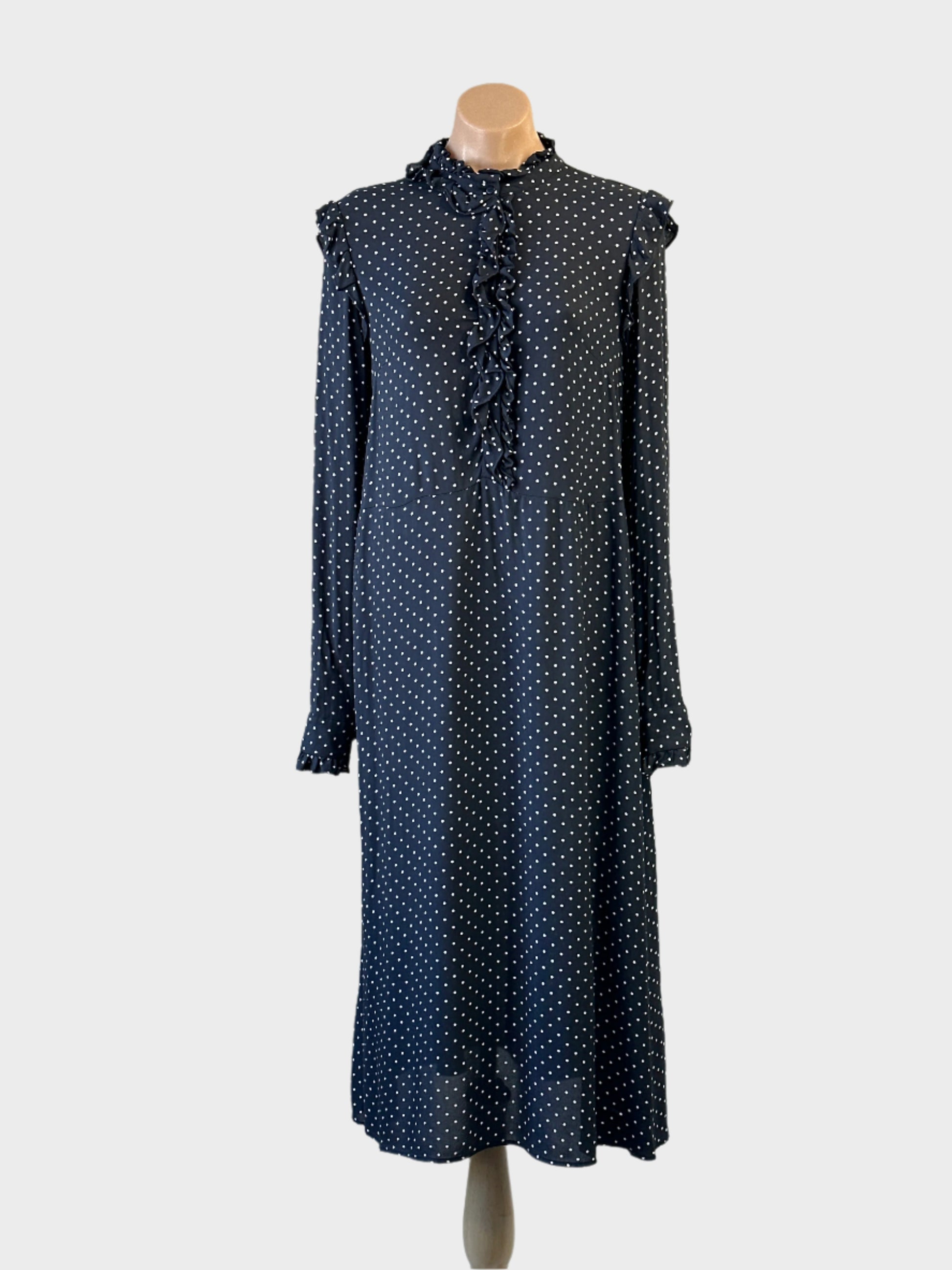 H&M dress in navy with white polka dots and frill details for office wear.
