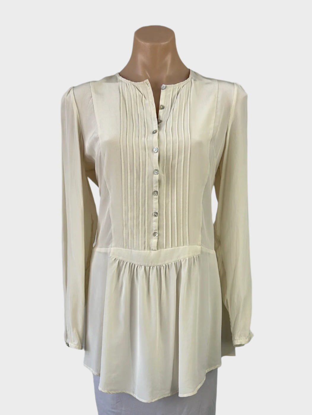 Hammock & Vine cream silk shirt with pin tuck bib, high low hem, and button cuffs for office or smart casual wear.