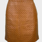 Designer Harry Who tan jersey mini skirt with woven leather front panel, contour waist and leather aglet zip for office or special events wear.