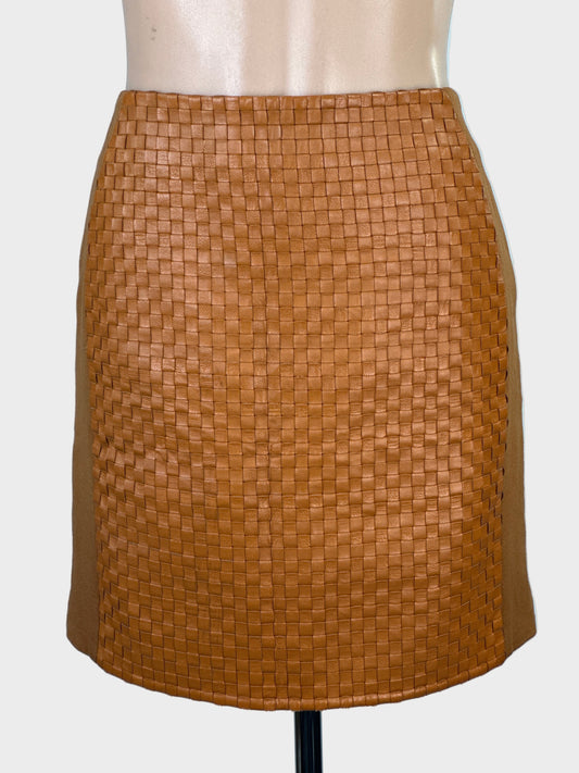 Designer Harry Who tan jersey mini skirt with woven leather front panel, contour waist and leather aglet zip for office or special events wear.