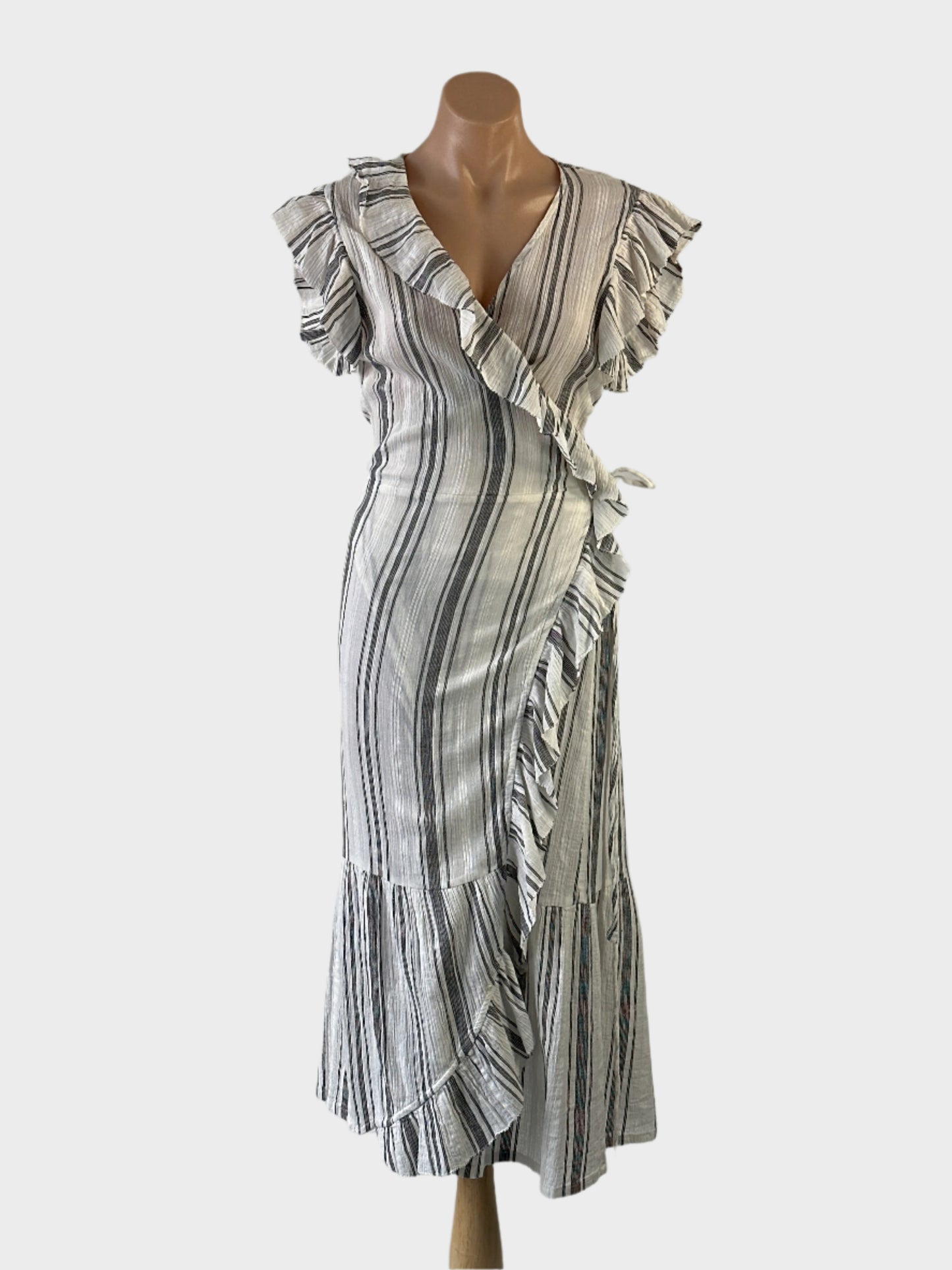 Designer Husk wrap dress in grey cheesecloth with striped print, ruffle cap sleeves and tulip skirt for smart casual or resort wear.