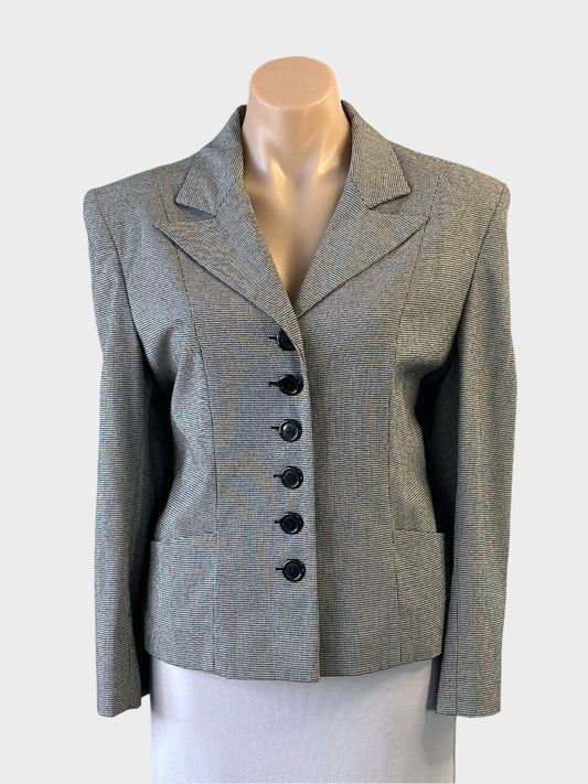 I.Q. Trademark single breasted jacket in black and white houndstooth with six button closure for office wear.