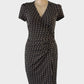 Jacqui E sheath dress in black & beige jersey with chain style print, surplice neck and draped skirt for office wear.