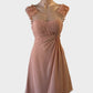 Jadore pink sleeveless A-line dress with pleated bodice and appliqué flowers for formal or special events.