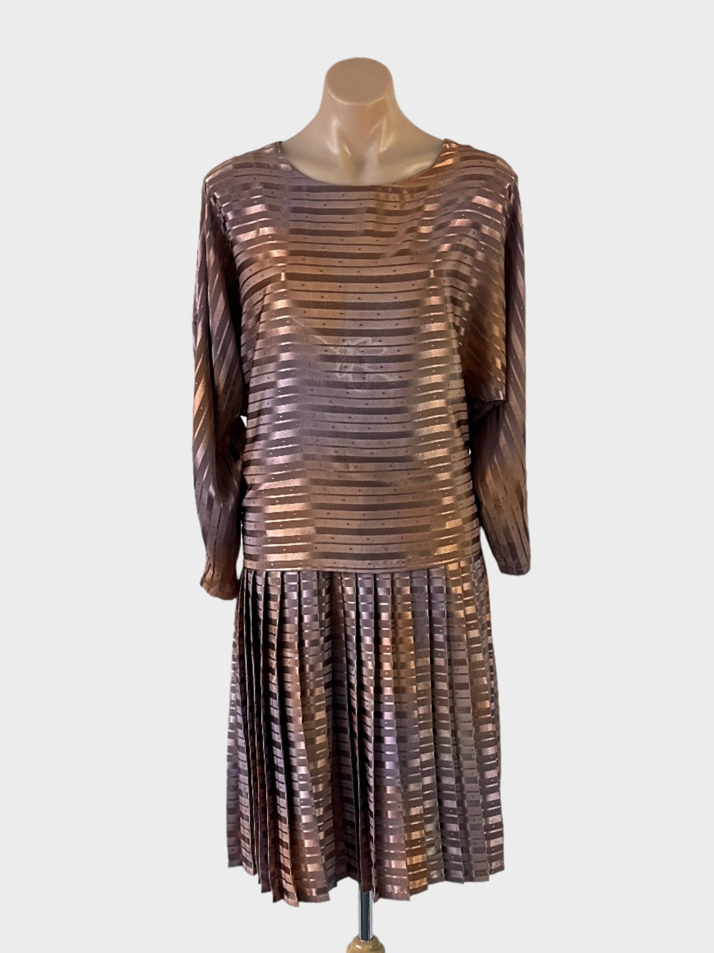 Vintage designer Jaki K drop waist dress in brown striped print with acid wash floral motifs, overlay top and accordion pleated skirt for special events.