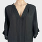 Joie black classic blouson top in pure silk with pleated front, notched neck, and elasticated hem for evening wear.