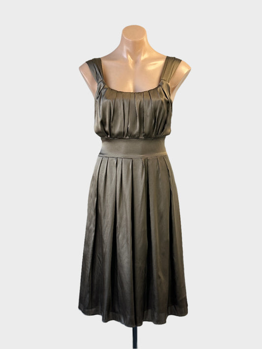 Designer Joseph sleeveless A-line dress in bronze satin finish with pleated bodice and sash for evening wear.