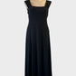Designer Joseph Ribkoff dress in black jersey with square neckline and flared skirt for evening or formal wear.