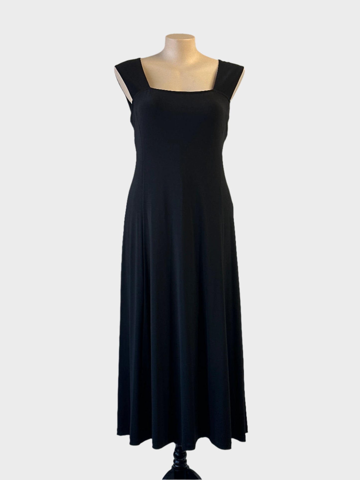 Designer Joseph Ribkoff dress in black jersey with square neckline and flared skirt for evening or formal wear.