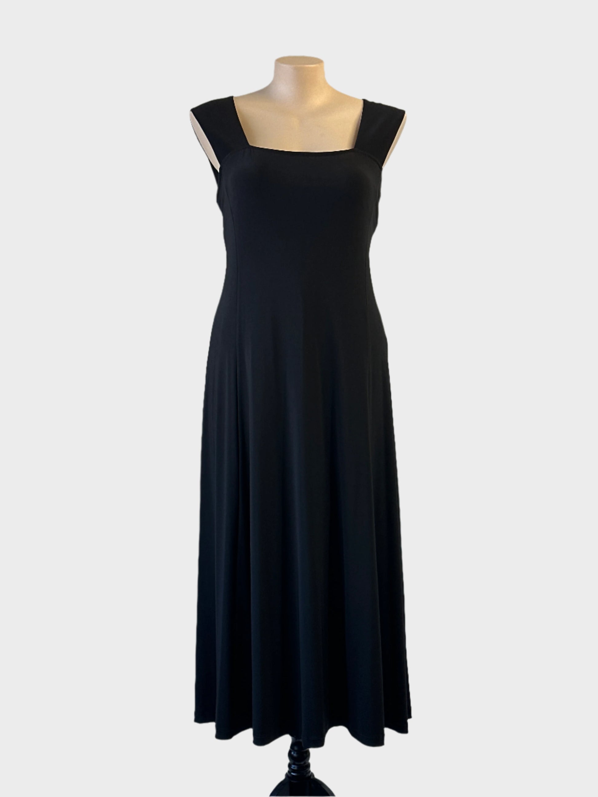 Designer Joseph Ribkoff dress in black jersey with square neckline and flared skirt for evening or formal wear.