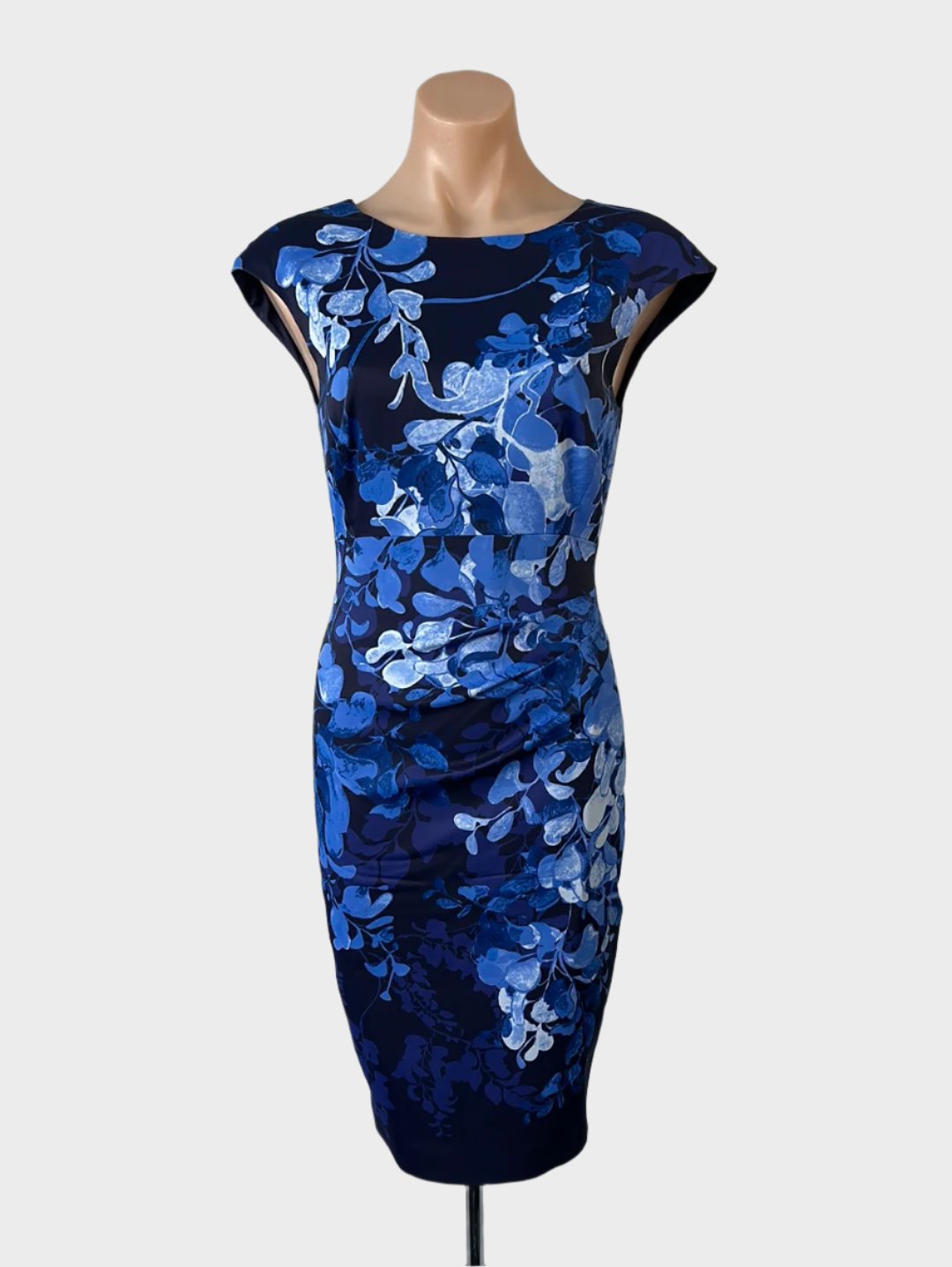 Designer Karen Millen sleeveless sheath dress in blue floral print with bateau neck, ruched waist, and pencil skirt for office wear