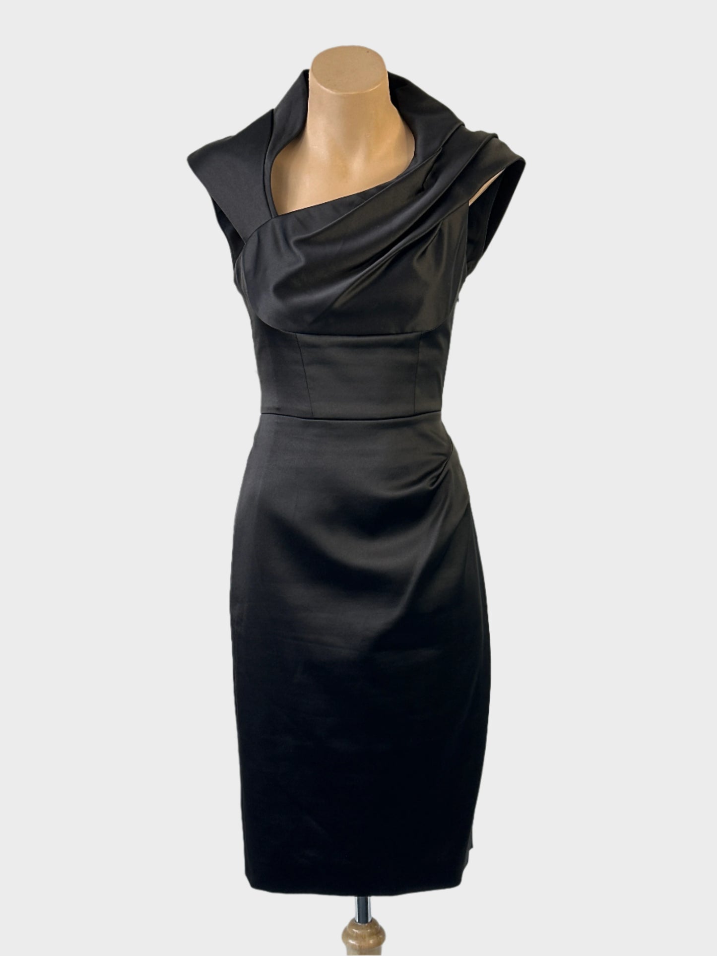 Designer Karen Millen sheath dress in black with satin finish, asymmetric neck, draped bodice and pencil skirt for evening or formal wear.