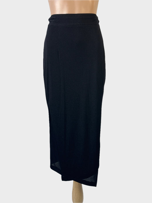 Designer Lisa Ho wrap skirt in black jersey with wide waistband and slanted hem for evening or office wear.