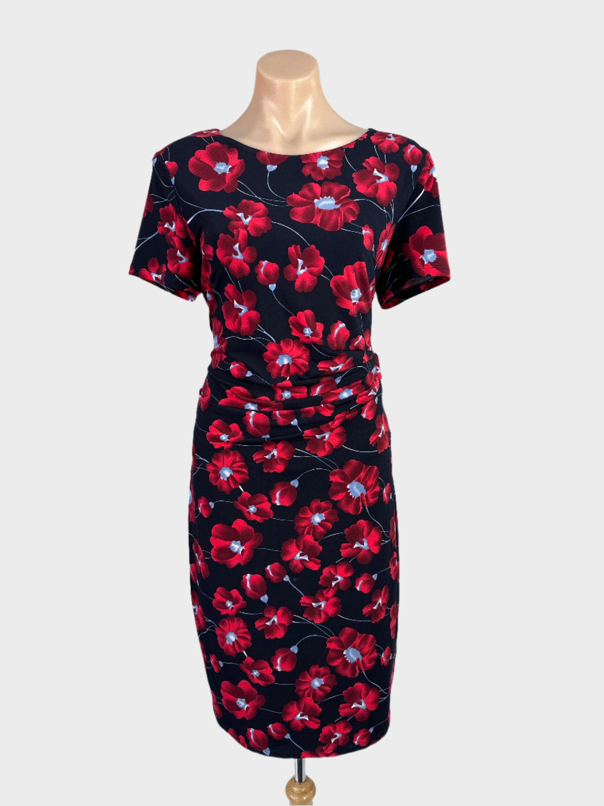 Liz Jordan black and red sheath dress in jersey with poppy print, ruched waist and straight skirt for office wear.