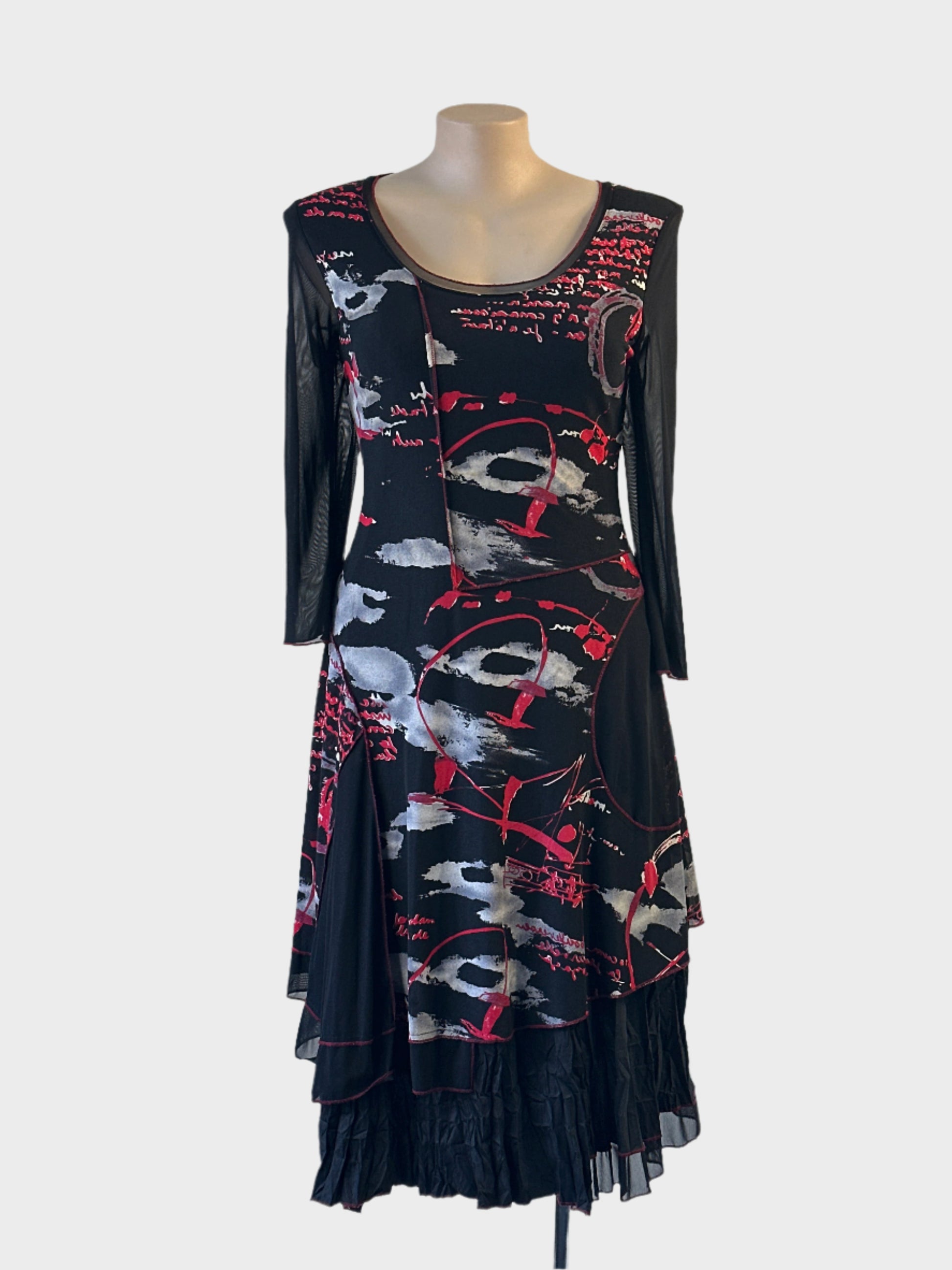Designer L'Officiel New Zealand black and red drop waist dress with mesh overlay and flared crinkle skirt for evening wear.