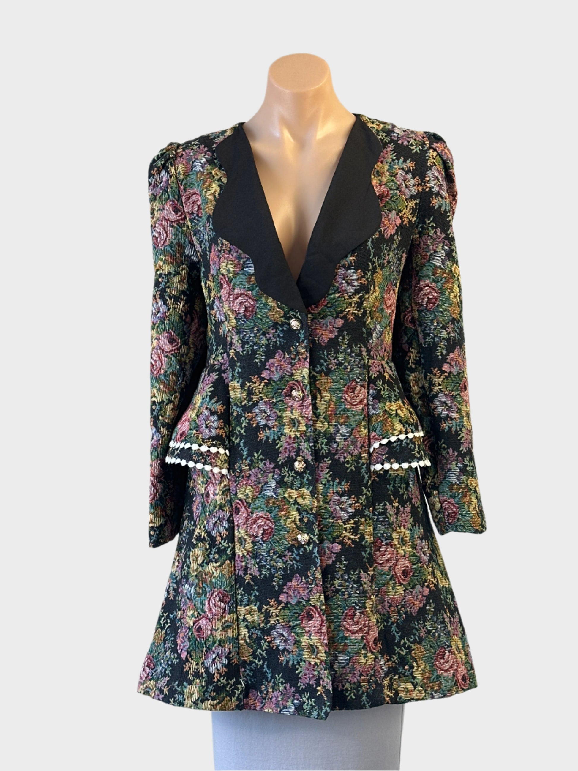 Love lady steam punk style floral tapestry frock coat with contrast lapels and pom pom trim, ideal for smart casual or special events.