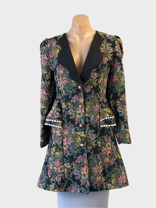 Love lady steam punk style floral tapestry frock coat with contrast lapels and pom pom trim, ideal for smart casual or special events.