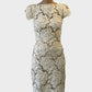 Designer Lover sheath dress in white with appliqué rosettes and scallop edging for special events wear.
