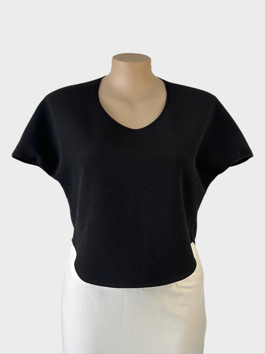 Designer MAISON POI crop top in black textured weave with scoop neck, drop shoulders and high low hem for office or smart casual wear.