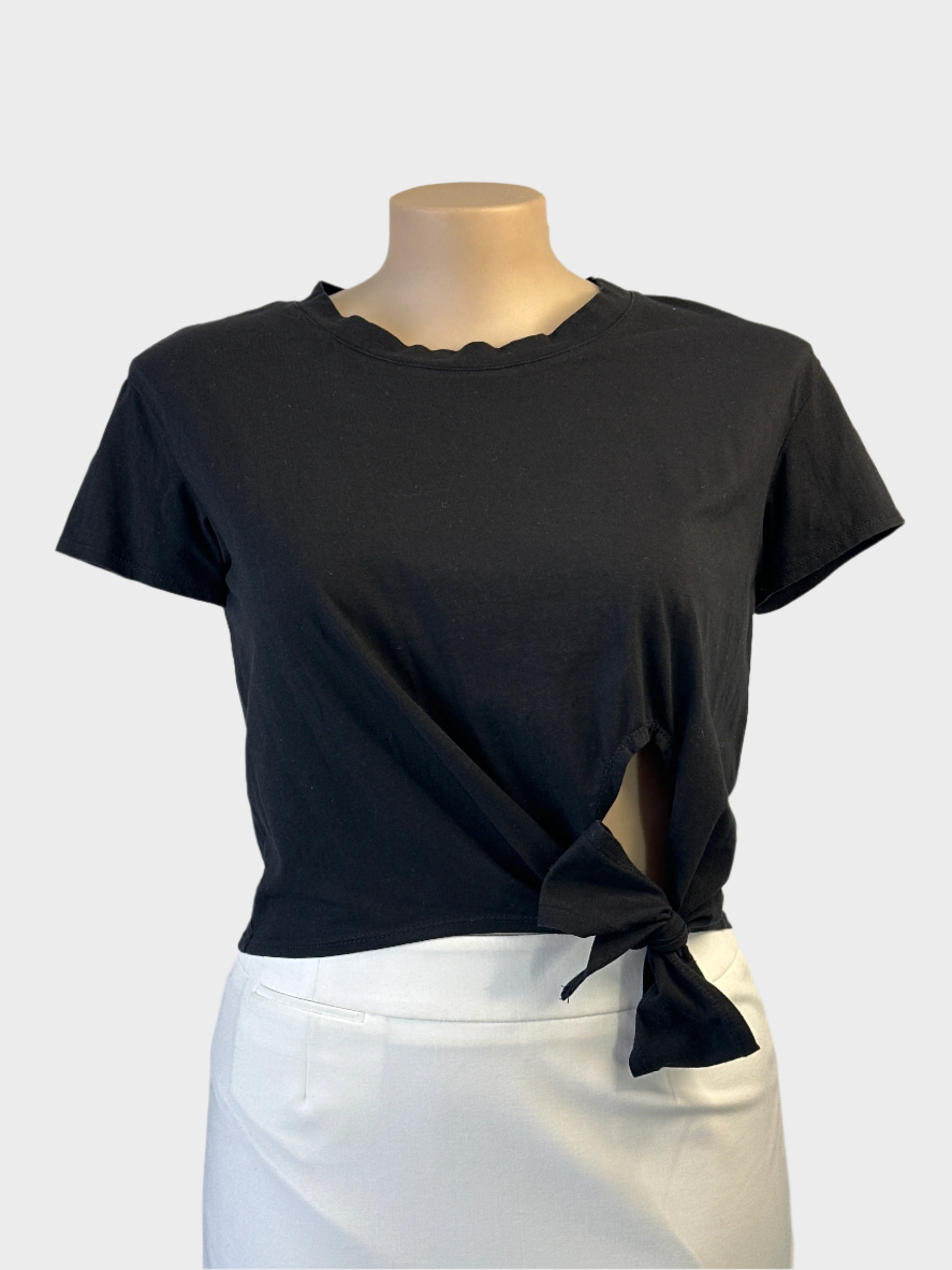 Mia sleeveless t-shirt top in black jersey with side hip tie for sporty luxe or resort wear.