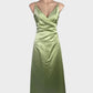 Monica green sleeveless dress in satin finish with surplice neck, spaghetti straps and pleated ruched waist for formal wear.