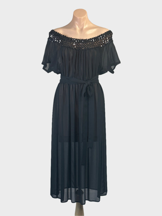Vintage 70’s black off the shoulder chiffon dress with sequinned neckband and gathered skirt for evening wear.