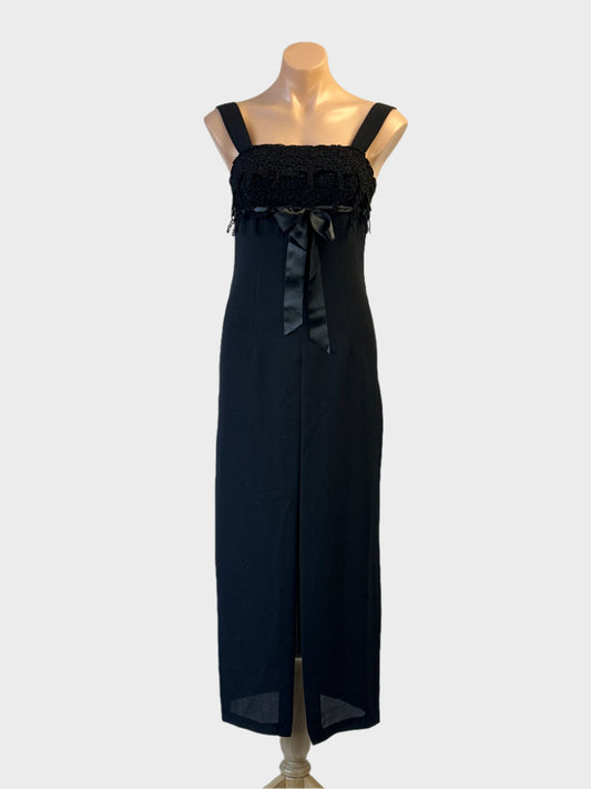 Mr K empire waist gown in black with guipure lace bodice and split skirt for formal wear.