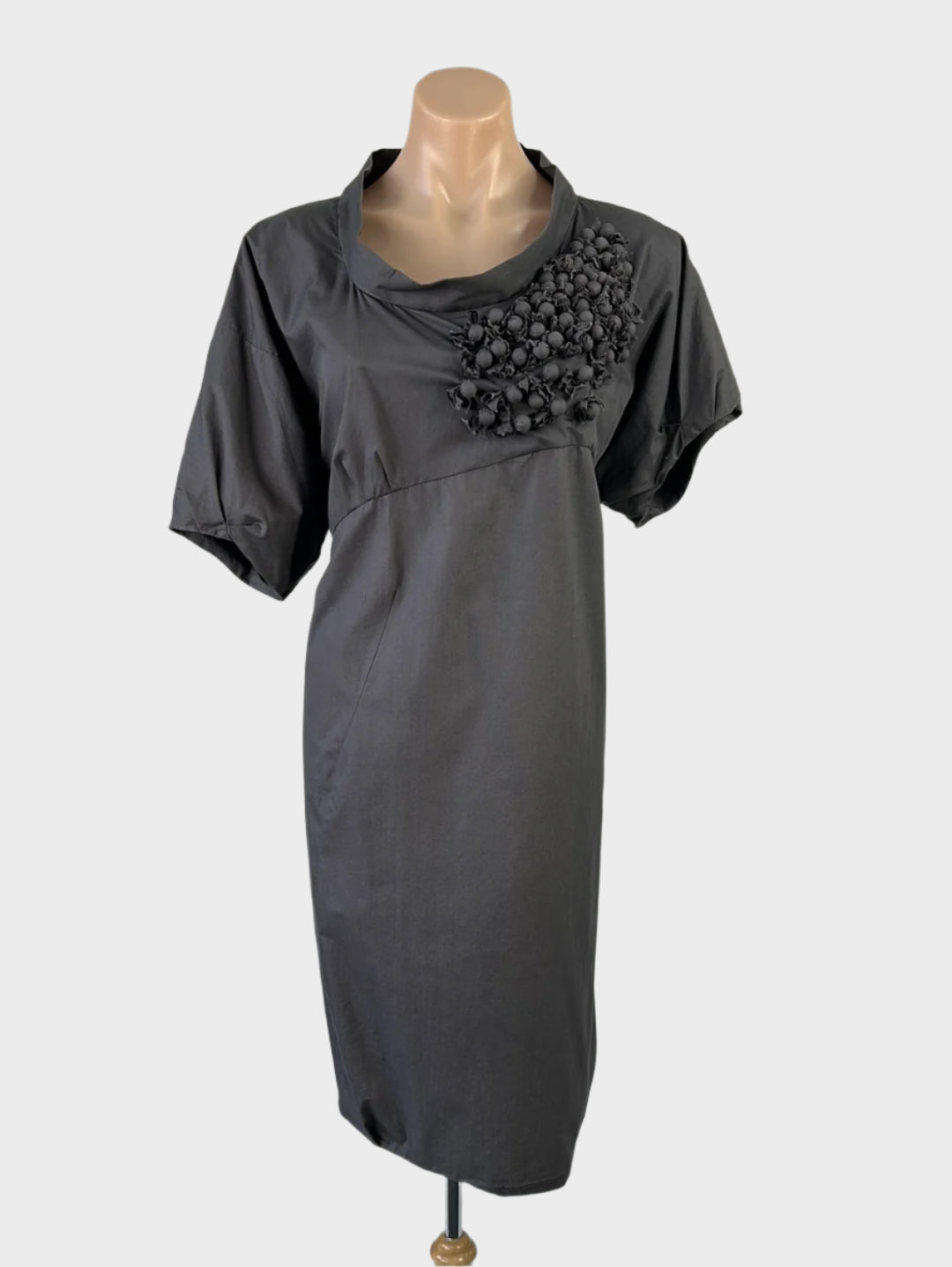 Designer Muccia steel grey asymmetric shift dress in cotton with appliqué balls, scoop neck, and empire waist for office wear.