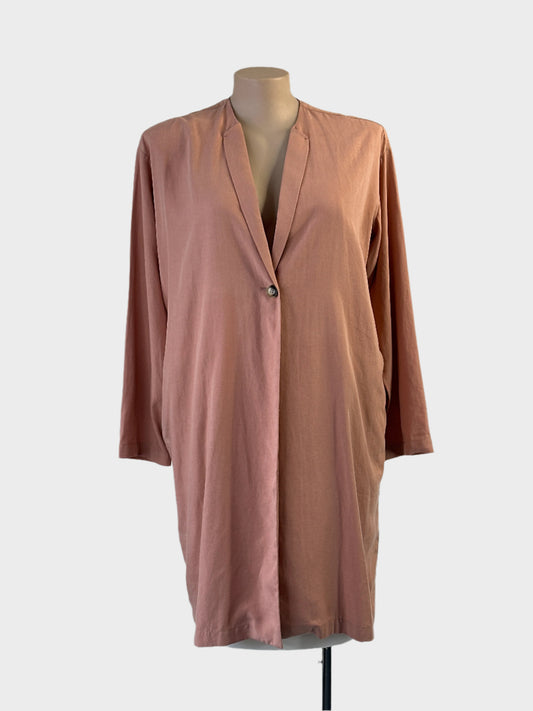 Designer naïf duster coat in pink linen blend with narrow lapels and in-seam pockets for office or smart casual wear.