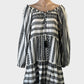 Next black and white boho smock dress in striped weave with pompom trim for resort or smart casual wear.