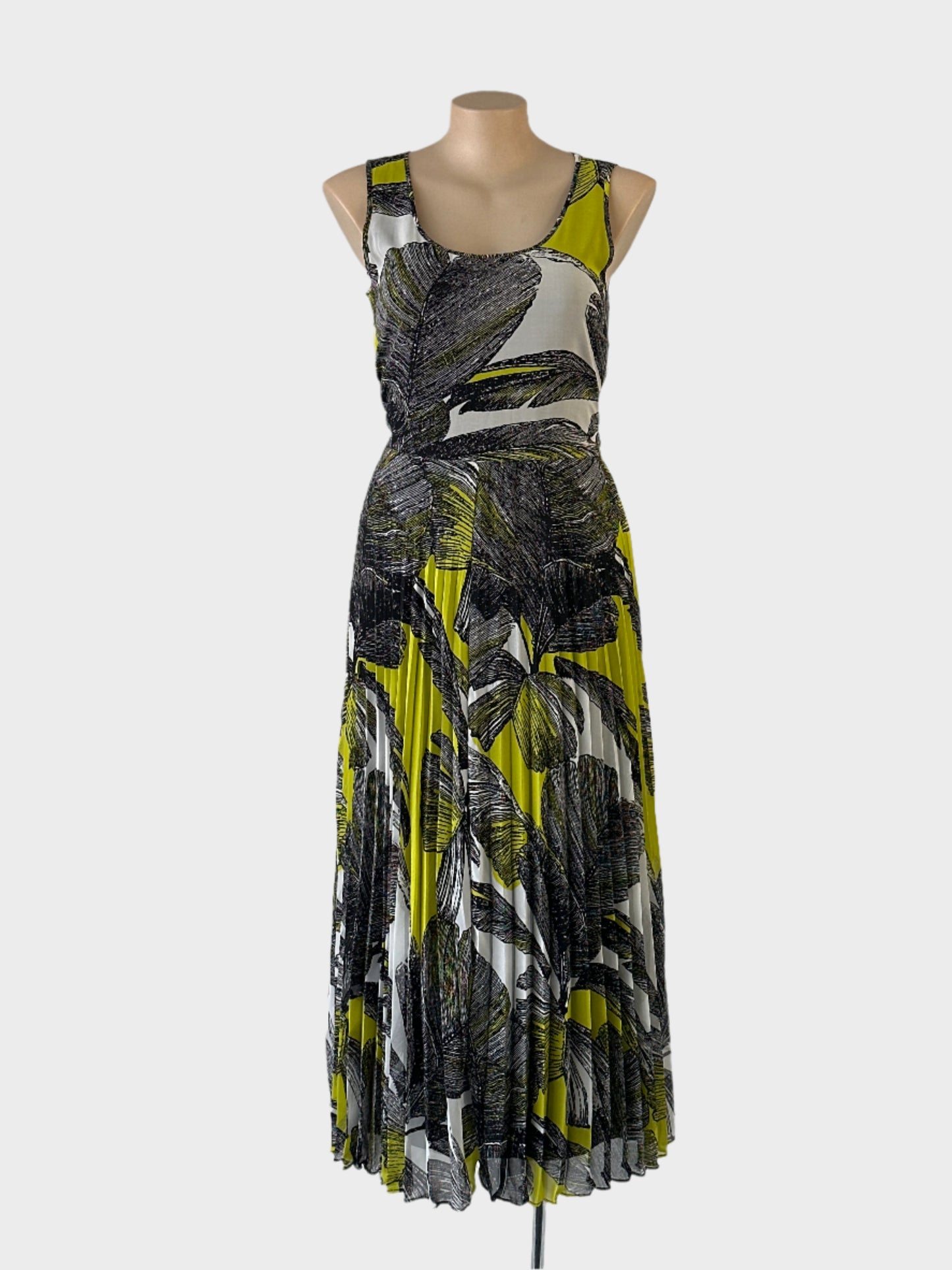 No Label A-line maxi dress in green and black with bright botanical print, u-shaped neck and accordion pleated skirt for smart casual or resort wear.