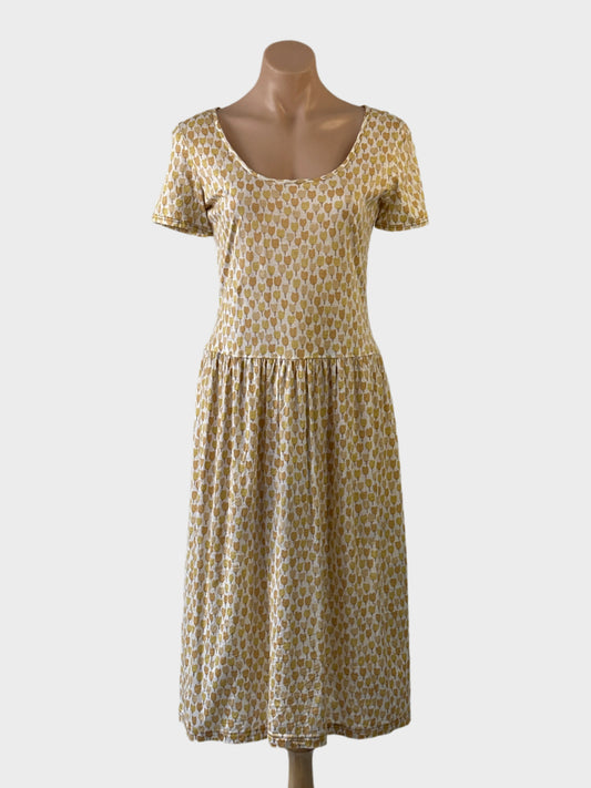 No Label vintage 70's drop waist sun dress in yellow cotton jersey with floral tulip print, short sleeves and gathered skirt for smart casual or resort wear.