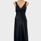 NOVITA bias cut dress in black with v-neck and tie back sash for formal or evening wear.