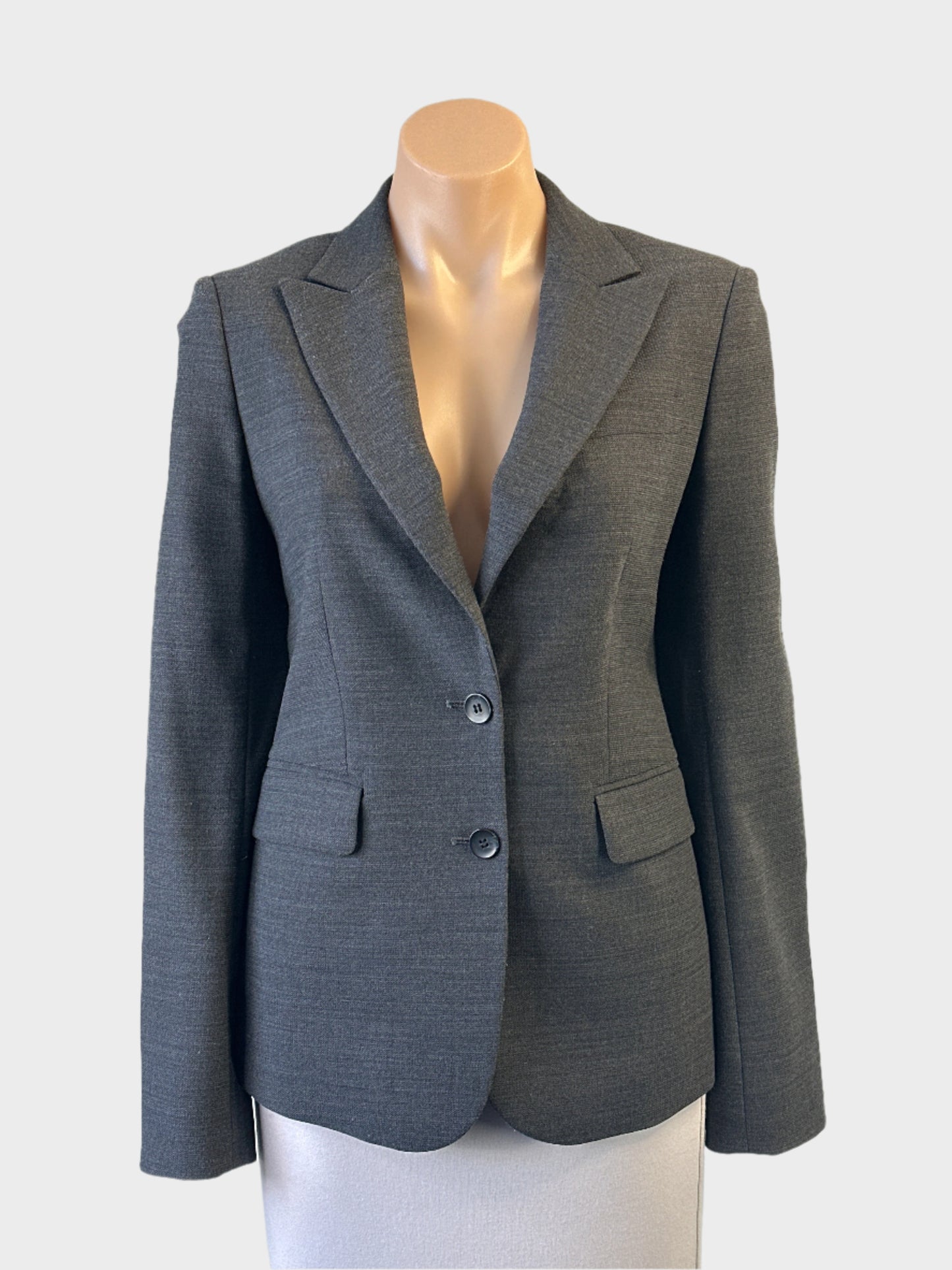 Oxford single breasted jacket in charcoal with wing lapels, button front and flap pockets, ideal for office wear.