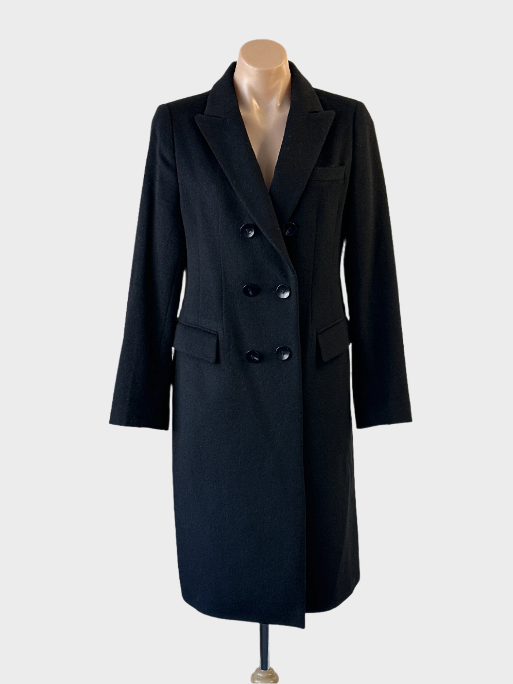 Oxford double breasted reefer coat in black with wing lapels and flap pockets for office wear.
