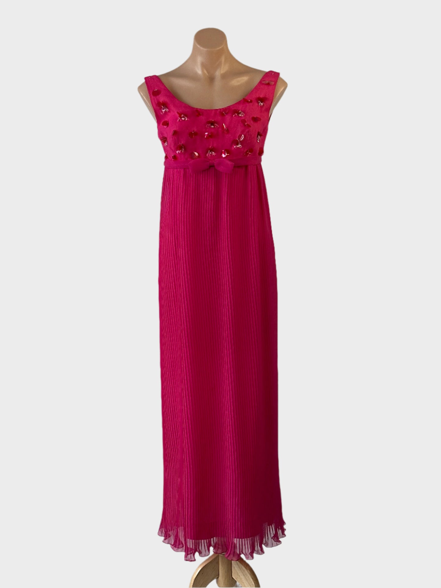 Designer vintage Patou Melbourne empire waist gown in pink with sequin beaded bodice, scoop neck and pleated skirt for formal or evening wear.