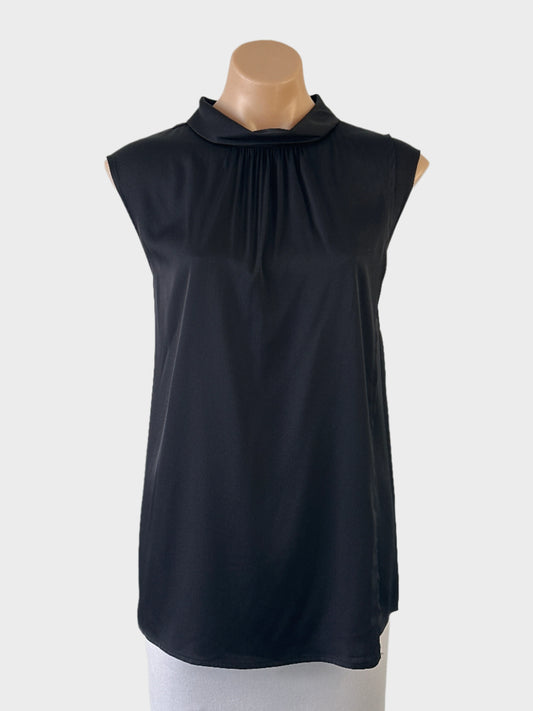 Designer Perri Cutten asymmetric top in black with lustrous finish, pleated front overlay, sunburst neck and keyhole back for office or evening wear.