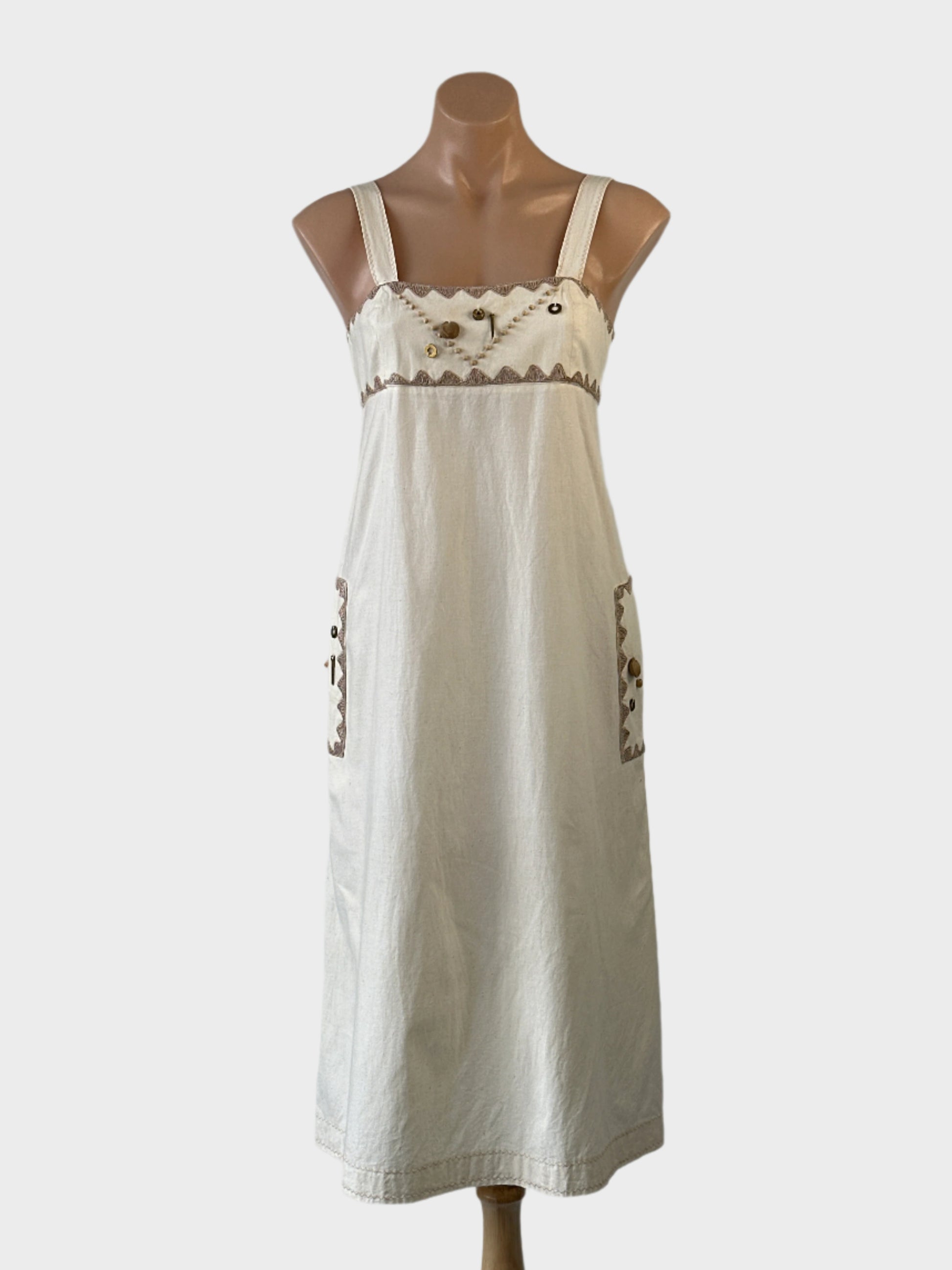 Vintage designer Prue Acton sleeveless sundress in unbleached calico with embroidered trim, appliqué beads and brass hardware for smart casual or special events.