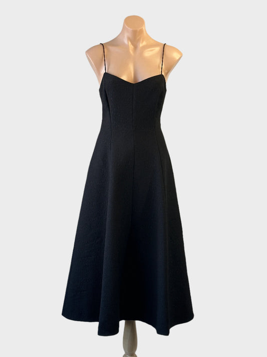 Rebecca Vallance black princess line midi dress with sweetheart neck, spaghetti straps and flared skirt — formal wear.